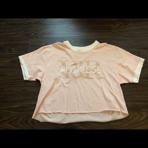 young and reckless baby pink cropped t-shirt